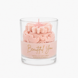 Beautiful You scented candle in soft pink with golden lettering, graceful whipped top and daisy on top.
