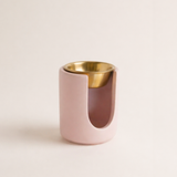 Handmade blush pink Loesieloe wax melt burner made from cast porcelain plaster with golden dish and small bow detail.