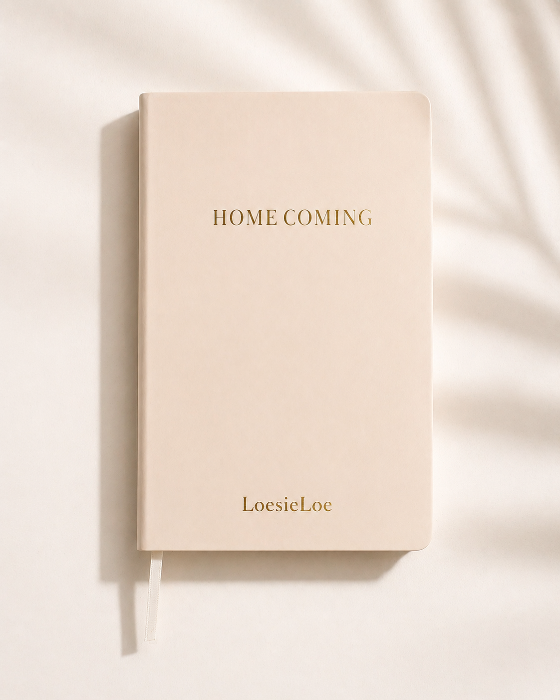 Homecoming notebook in A5 size with a soft cover, subtle golden details and ribbon bookmark.
