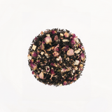 La Vie en Rose tea in a glass jar with wooden lid and golden lettering.
